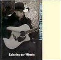 Spinning Our Wheels von John Arthur Martinez